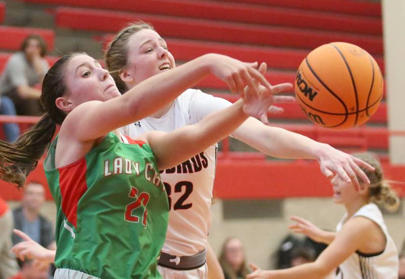 Metamora's Ella Russell breaks up a pass intended for L-P's Brianna Ruppert during the Ottawa Girls Holiday Tournament on Monday, Dec. 16, 2024 in Kingman Gym at Ottawa High School.