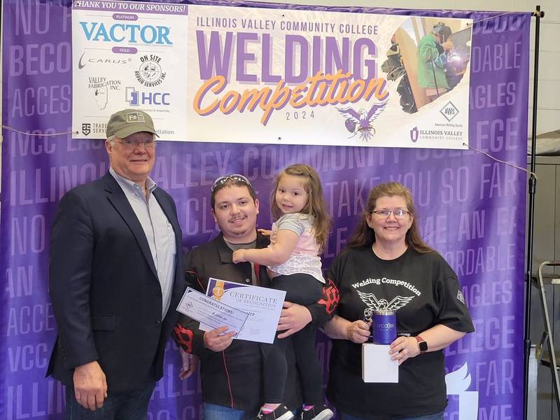 Javier Montes, Cornell, earned first place and prizes in the college GMA welding division at IVCC’s second annual welding competition April 13. Montes is shown with IVCC welding program coordinator Theresa Molln (right) and Ron Ashelford, district director of American Welding Society Section 13. AWS co-sponsors the event and provides scholarship prizes.