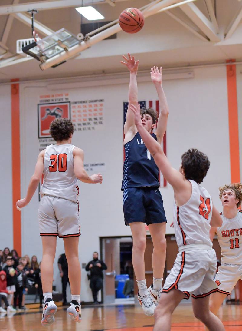 Lake Park's Camden Cerese (1) score to tie up the game and send it to overtime against Wheaton Warrenville South during a game on Saturday, Jan. 7, 2023.