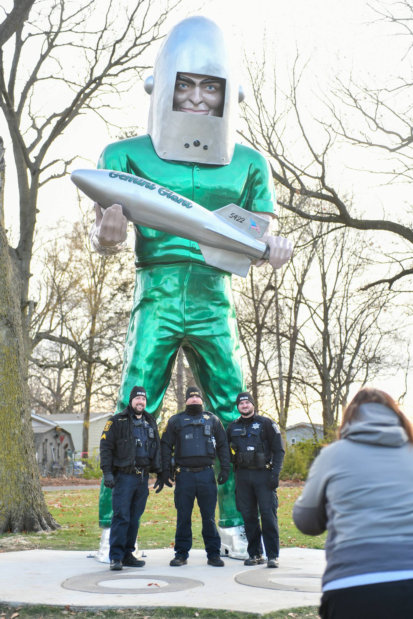 Wilmington Police officers pse for a photo with the Gemini Giant on Saturday during the Gemini Giant Homecoming event at Wilmington's South Island Park.