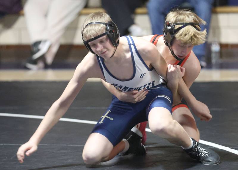 Marquette's Logan Liskonich wrestles Bradley-Bourbonnias's Zach Hoffner on Wednesday, Jan. 14, 2026 in Bader Gymnasium at Marquette Academy.