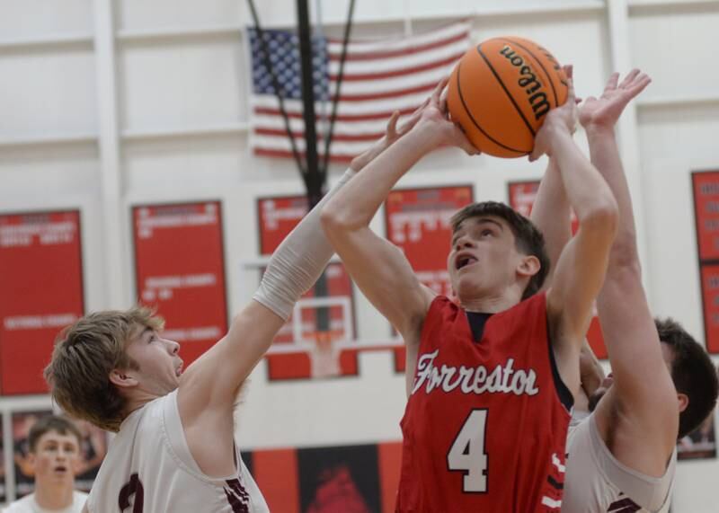 Forreston's Brady Gill (4) battles Annawan defenders during the championship of the 1A Amboy Regional on Friday, Feb. 28, 2025 at Amboy High School.