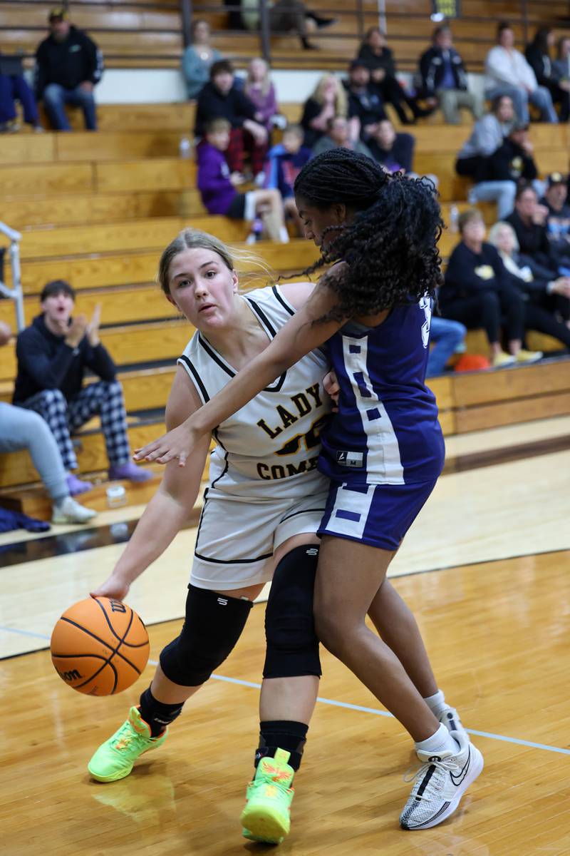 Reed-Custer's Harlie Liebermann drives to the lane against Grace Christian's Makayla Lonergan during the Comets' 55-24 victory over Grace Christian at the Reed-Custer Classic on Monday, Nov. 17, 2025.