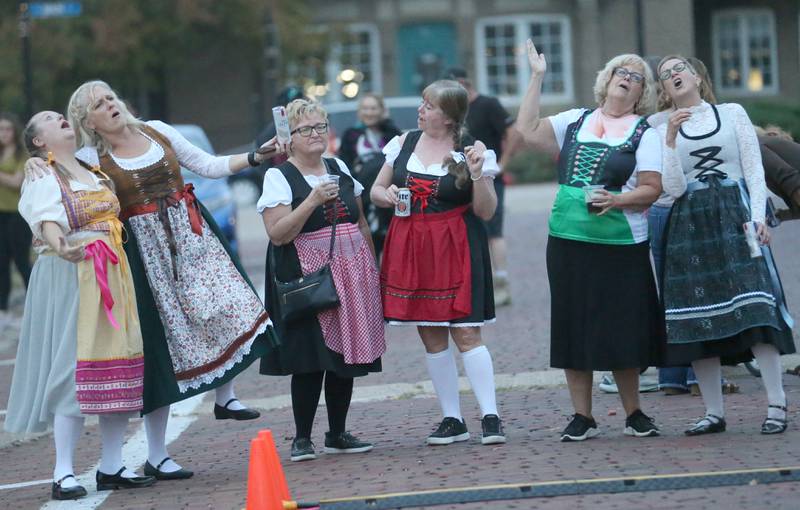Ladies enjoy listening to music from the Heidelberg German Band during the Oktoberfest event on Saturday, Oct. 18, 2025 at Rotary Park in Princeton.