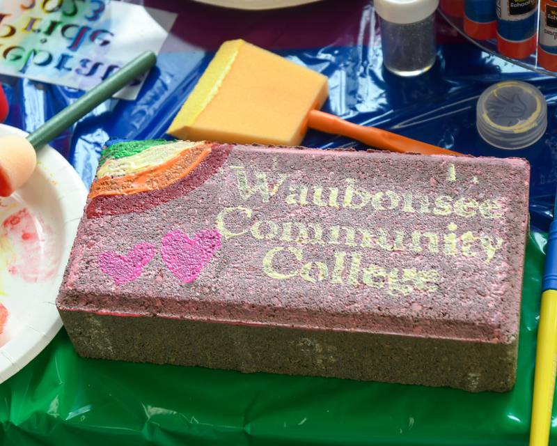 A brick was painted, by Emily McMicken a Waubonsee Community College employee, during the pride party held at Waubonsee Community College Plano’s campus on Thursday June 29, 2023.