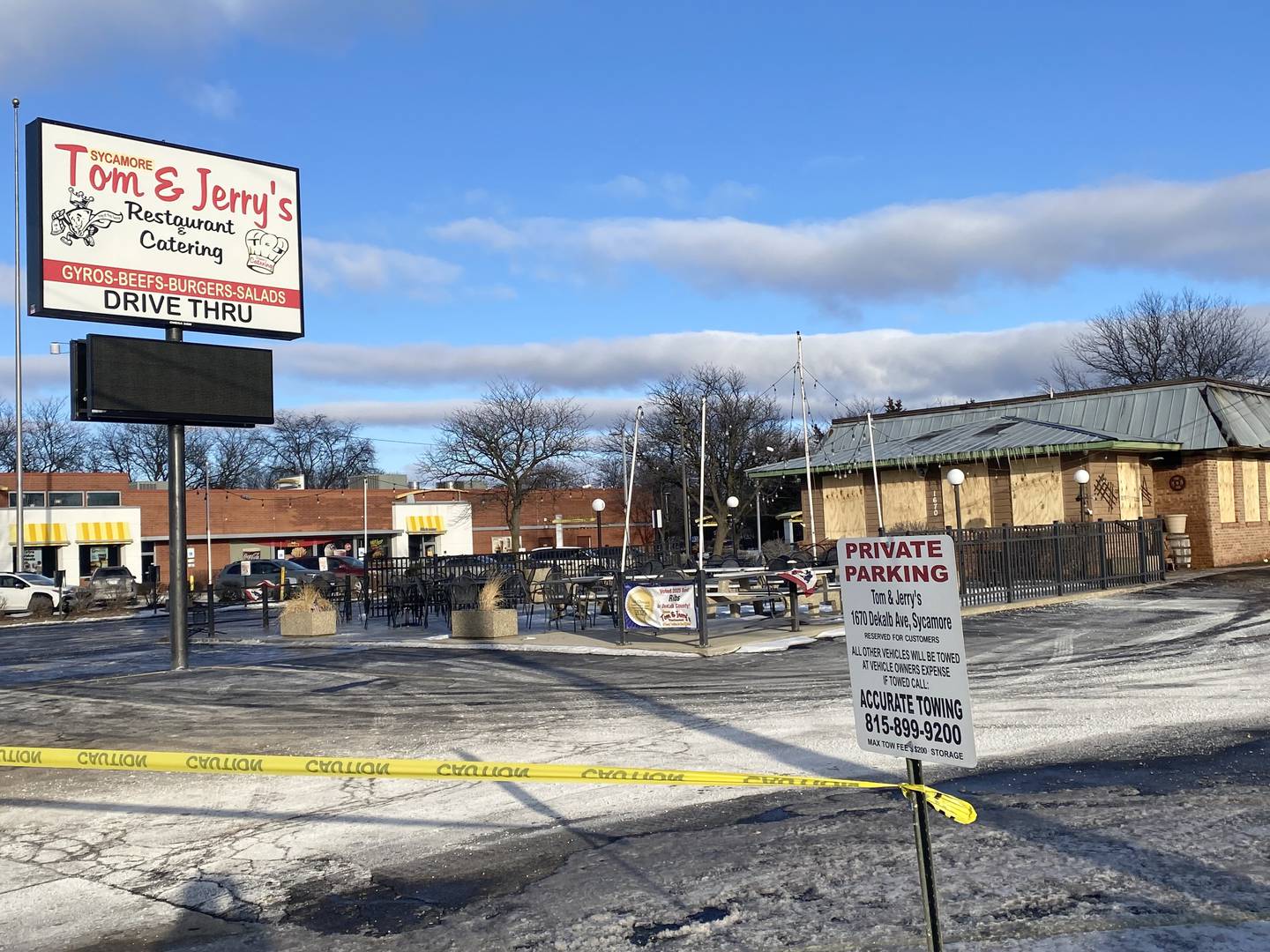 Police tape blocks the entrance to Tom and Jerry's restaurant, 1670 DeKalb Ave., Sycamore, after the building was destroyed by fire on Saturday, Jan. 31, 2026.