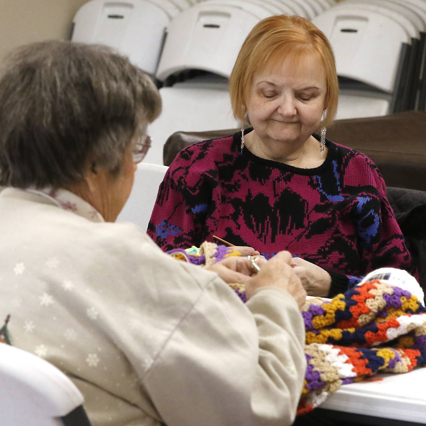 Sharon Foley and Mary Holm talks and knit on Thursday, Jan. 18, 2023, at the McHenry Township Senior Center, in Johnsburg. The center will be hosting a presentation on senior scams on Friday, at 1 p.m.