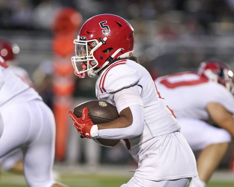 Yorkville's T.J. Harland (5) runs with the ball during football game between Yorkville at Plainfield East Friday, Sept 19, 2025 in Plainfield.