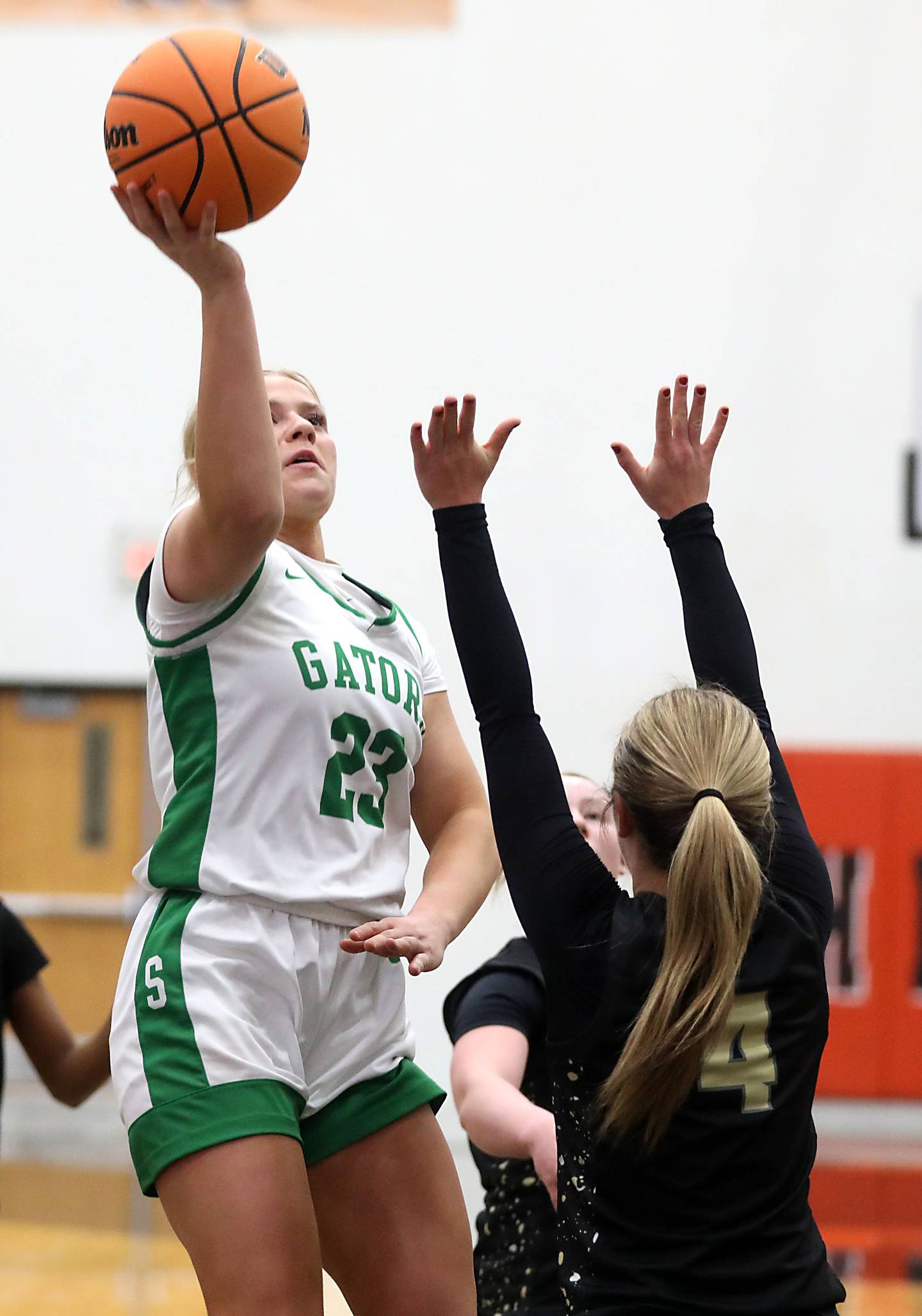 Crystal Lake South's Laken LePage shoots the ball overGrayslake North's Lucy Roscoe during a Northern Illinois Holiday Classic semifinal girl basketball game on Tuesday, Dec. 16, 2025, at McHenry High School.