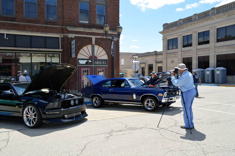 Ken Zink, of Earlville, takes a photo of a car at the 35th annual Polo Car Show on Saturday, Aug. 10, 2024.