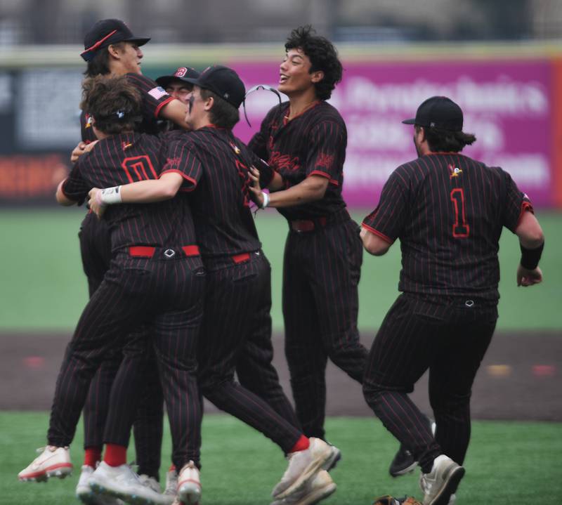 Benet Academy players celebrate their 11-6 victory over Cary-Grove during the Class 3A state baseball semifinal at Slammers Stadium on Friday, June 13, 2025 in Joliet.