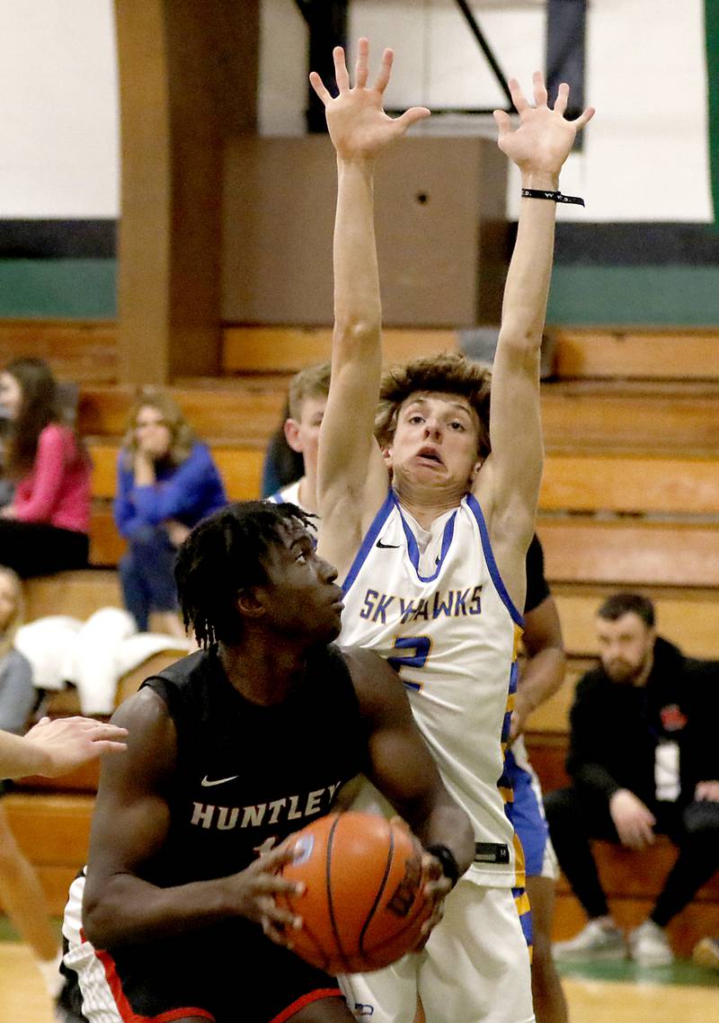 Huntley's Sheldon Aninagyei Bonsu tries to fake out Johnsburg's Riley Johnson during the boy’s game of McHenry County Area All-Star Basketball Extravaganza on Sunday, April 13, 2025, at Alden-Hebron’s Tigard Gymnasium in Hebron.