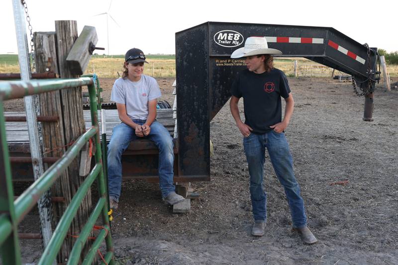 Dominic Dubberstine-Ellerbrock, right, talks with his brother Michael after bull riding practice. Dominic will be competing in the 2022 National High School Finals Rodeo Bull Riding event on July 17th through the 23rd in Wyoming. Thursday, June 30, 2022 in Grand Ridge.