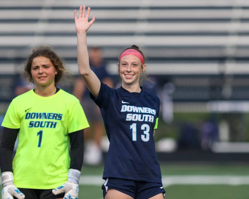 Downers Grove South's Emily Petring (13) is introduced before Class 3A Addison Trail Regional final soccer match between Downers Grove South at Downers Grove North.  May 19, 2023.