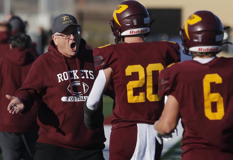 Richmond-Burton Head Coach Mike Noll greats his players aft a touchdown during an IHSA Class 3A quarterfinal playoff football game against Monmouth-Roseville on Saturday, November 15, 2025, at Richmond-Burton High School, in Richmond.