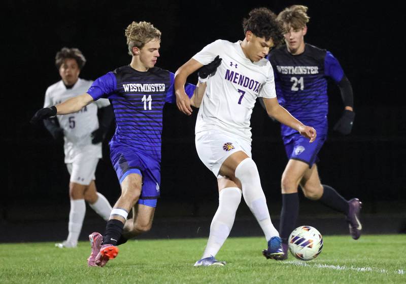 Mendota's Isaac Diaz tries to hold of Harvest-Westminster's Elijah Schultze Friday, Oct. 31, 2025, during the Class 1A Indian Creek Sectional championship game Friday in Waterman.