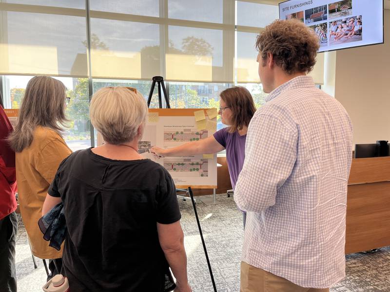 Downers Grove residents review renderings of potential plans for the downtown area as well as Fairview Avenue at a recent open house at the Downers Grove Civic Center