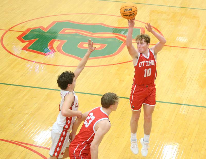 Ottawa's Evan Snook shoots a three point shot as teammate Owen Sanders boxes out L-P's Mikey Hartman on Friday, Feb. 7, 2025 in Sellett Gymnasium at L-P High School.
