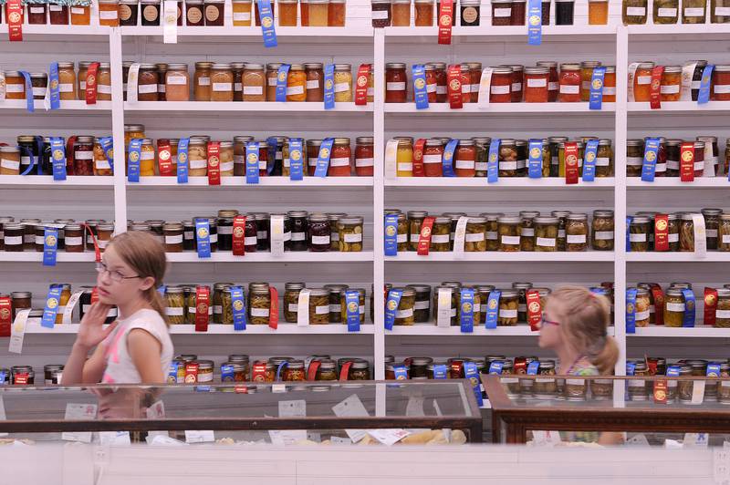 Hundreds of canned fruits and vegetables line a wall in the Home Arts Pavilion on Thursday, Sept. 5, 2024, at the Sandwich Fair.