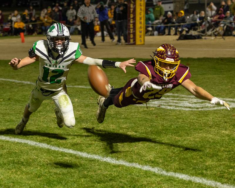 Asher Kargle (12) of Dwight and Morgan Haas (29) of Stockton leap for ball on Saturday, November 15, 2025 at John O' Boyle Field in Stockton.