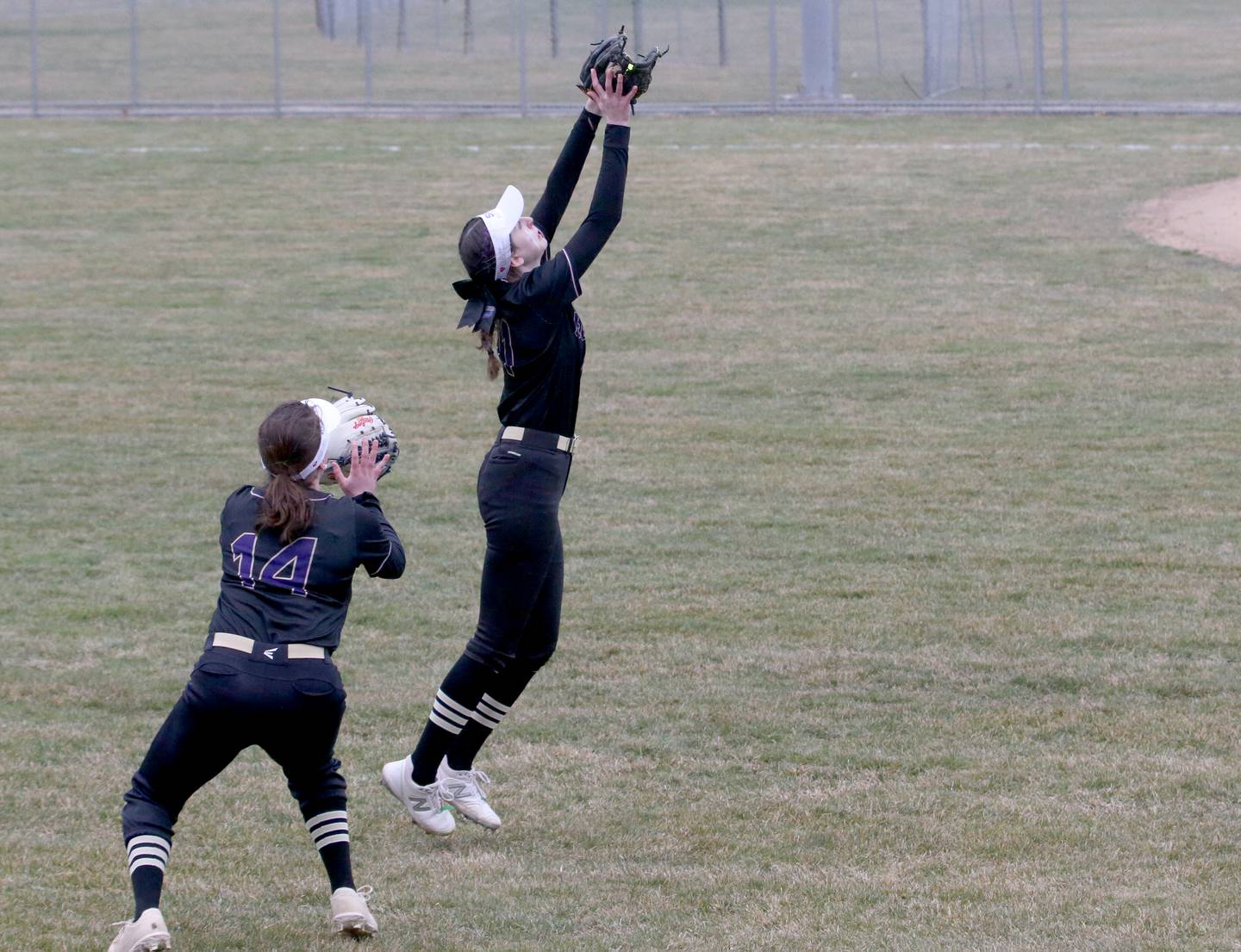 Serena's Makayla McNally makes a catch in center field as teammate Lanee Cole backs her up on Tuesday, March 21, 2023 at Ottawa High School.