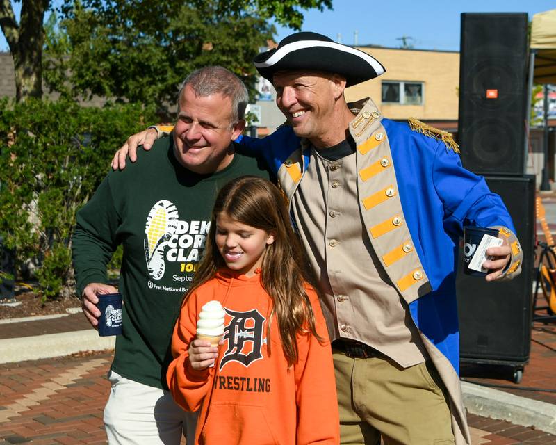 Justin Carlson (right) dressed as Baron Johann DeKalb, Olivia Weller, 9, of DeKalb and DeKalb Mayor Cohen Barnes pose for a photo during the Taste of DeKalb on Sunday, Sept. 29, 2024, downtown.