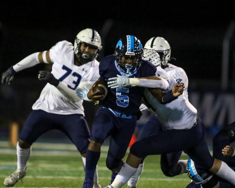 Downers Grove South's Kayden Smith (5) runs with the ball during Class 8A Playoff football game between Plainfield South at Downers Grove South on Friday, Nov 1, 2024  in Downers Grove.