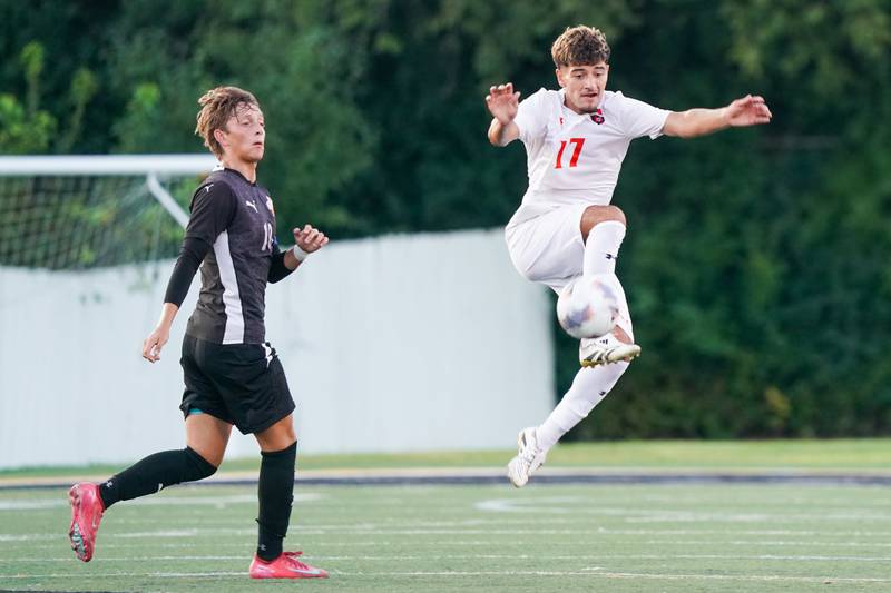 Oswego’s Jonathan Garcia (17) plays the ball against Wheaton Warrenville South's Semin Razman (10) during a soccer match at Wheaton Warrenville South in Wheaton on Thursday, Aug 28, 2025