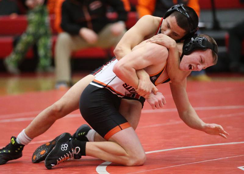 Ottawa's Ivan Munoz wrestles Sandwich's Nate Hill on Thursday, Jan. 12, 2023 in Kingman Gymnasium at Ottawa High School.