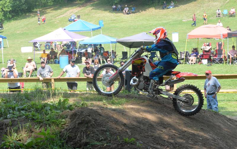 Wayne Schultz, 53, of Animosa, Iowa, clears the "table top" at the start of his run during the King of the Hill event at the Rock River Riders Motorcycle Club's hill climb on Sunday, July 16, 2023. Schultz made it to the top of the hill in 6.9 seconds to win the event.