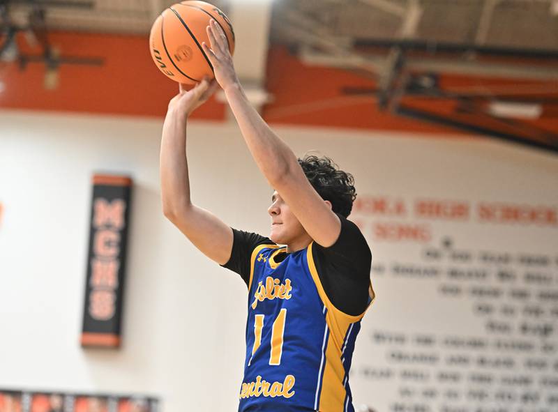 Joliet Central's Thomas Jemilo (11) shoots a jump shot during a conference game against Minooka on Friday, Jan. 10, 2025, at Minooka.