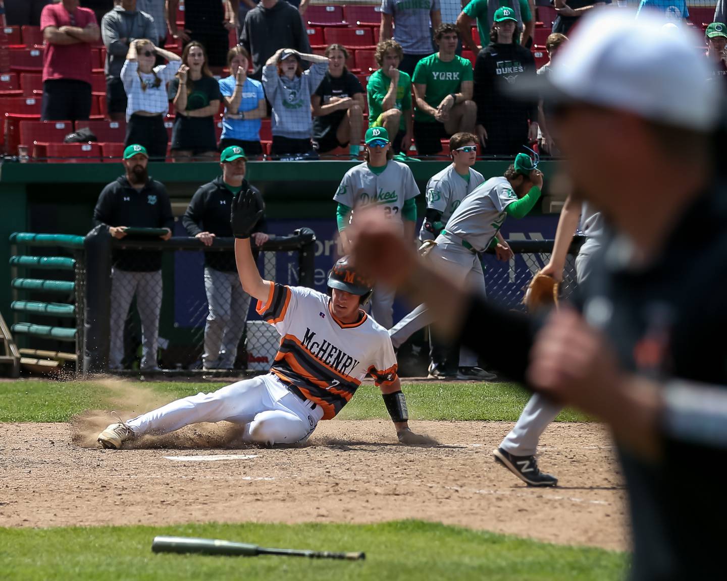 McHenry's Connor Rodgers (7) slides into home to score the game winning run for McHenry during the Class 4A Supersectional game between York at McHenry.  June 7, 2022.