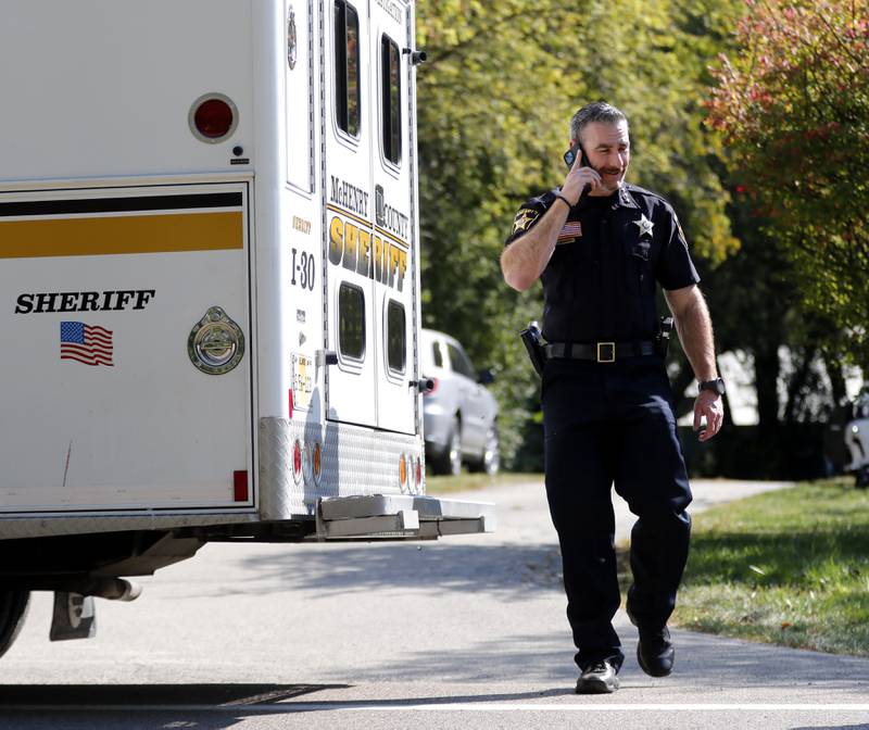 McHenry County Sheriff Robb Tadelman talks on the phone as deputies investigate a shooting in the  8900 block of East Tryon Grove Road Thursday, Oct. 10, 2024.