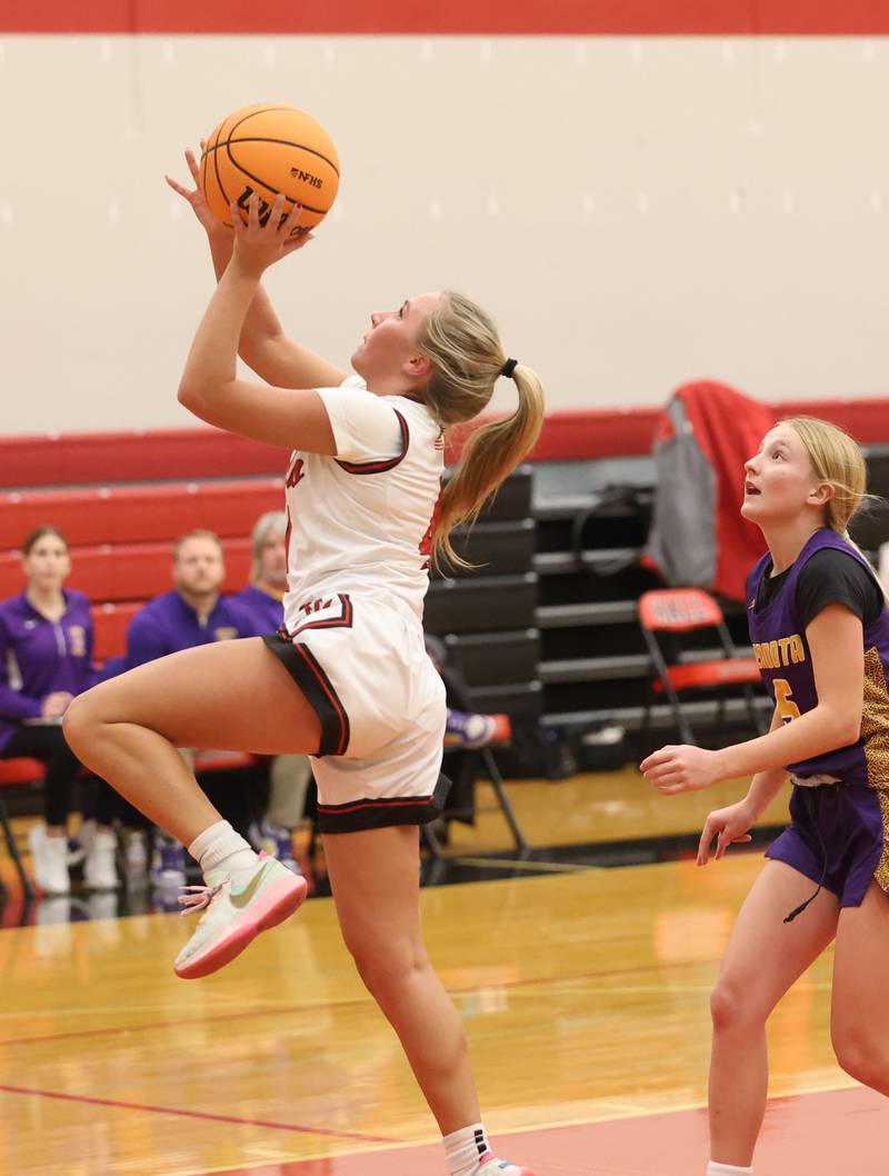 Hall's Charlie Pellegrini runs in for a layup over Mendota's Bella Bute on Monday, Dec. 1, 2025 at Hall High School.