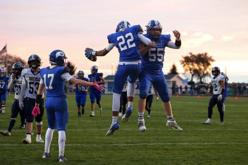 Clifton Central's Cash Minard (22) leaps in celebration with teammate Brody O'Connor after scoring a touchdown during the Comets' 24-6 victory over Knoxville in the Class 1A first-round playoff game on Saturday, Nov. 1, 2025.