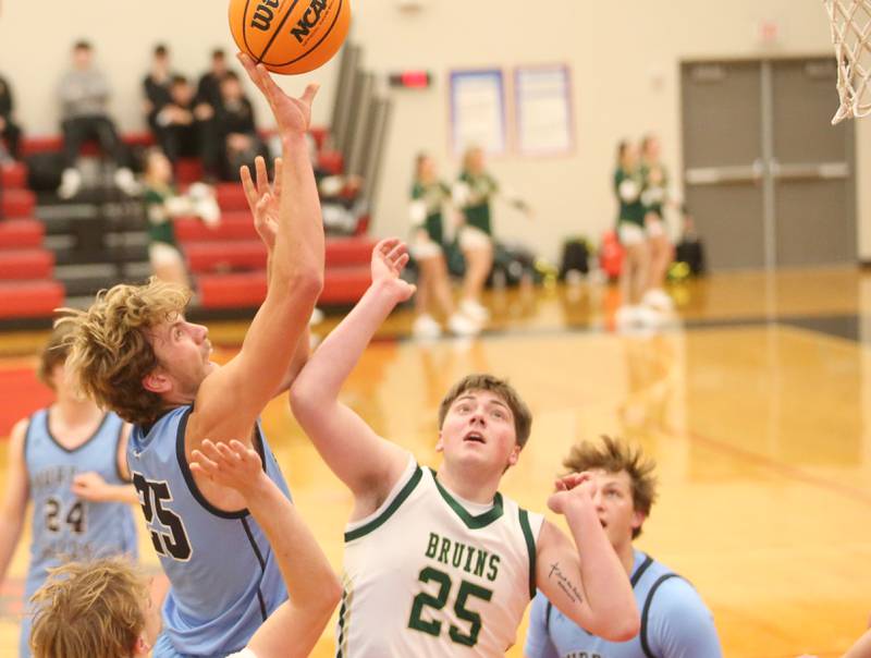 Bureau Valley's Landon Hulsing lets go of a shot over St. Bede's Jake Miglorini during the 50th annual Colmone Classic on Thursday, Dec. 12, 2024 at Hall High School.