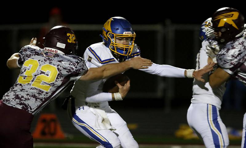 Richmond-Burton's Steven Siegel sacks Johnsburg's Anthony Bravieri during a Kishwaukee River Conference football game Friday, Oct. 7, 2022, between Richmond-Burton and Johnsburg at Richmond-Burton Community High School in Richmond.