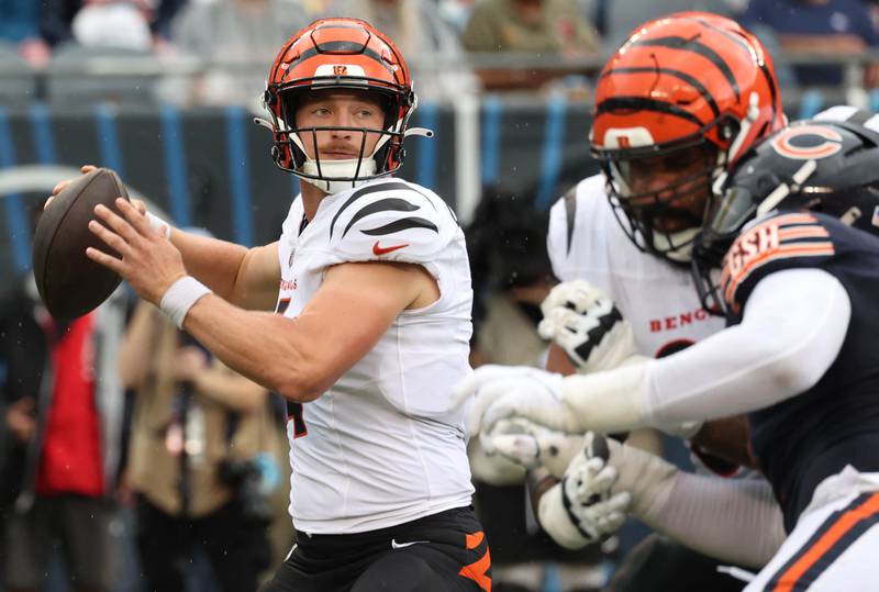 Former Northern Illinois University and current Cincinnati Bengals quarterback Rocky Lombardi winds up to throw while making his NFL debut Saturday, Aug. 17, 2024, at Soldier Field in Chicago. Lombardi checked in during the second half of a 27-3 loss to the Chicago Bears. Lombardi is competing for a roster spot with the Bengals.