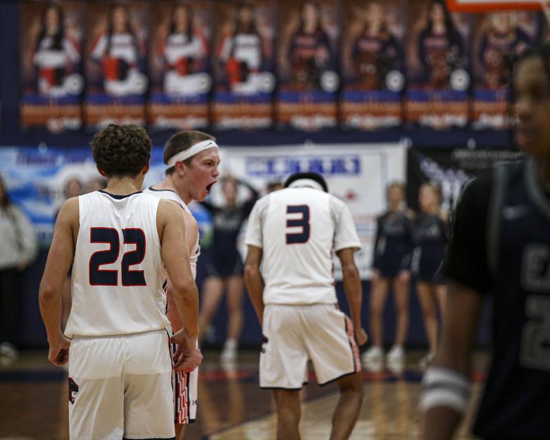 Oswego's Graham Schwab (12) reacts after a made basket by Cole Jansons (23) in the closing seconds of their basketball game between Oswego East at Oswego Friday, Jan 9, 2026 in Oswego.