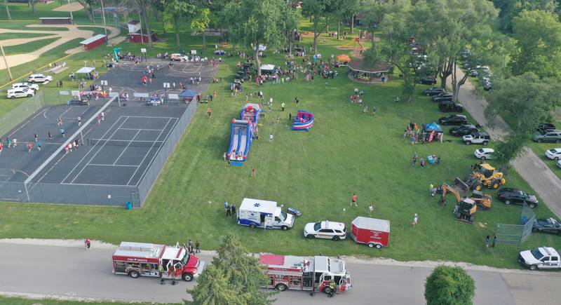 An aerial view of the crowd during the National Night Out event on Tuesday, Aug. 5, 2025 at Kirby Park in Spring Valley.  The event featured prizes, dodge ball tournament, bounce house, face painting and more. National Night Out is an annual community policing campaign held on the first Tuesday of August to create police-community partnerships and build safer neighborhoods.