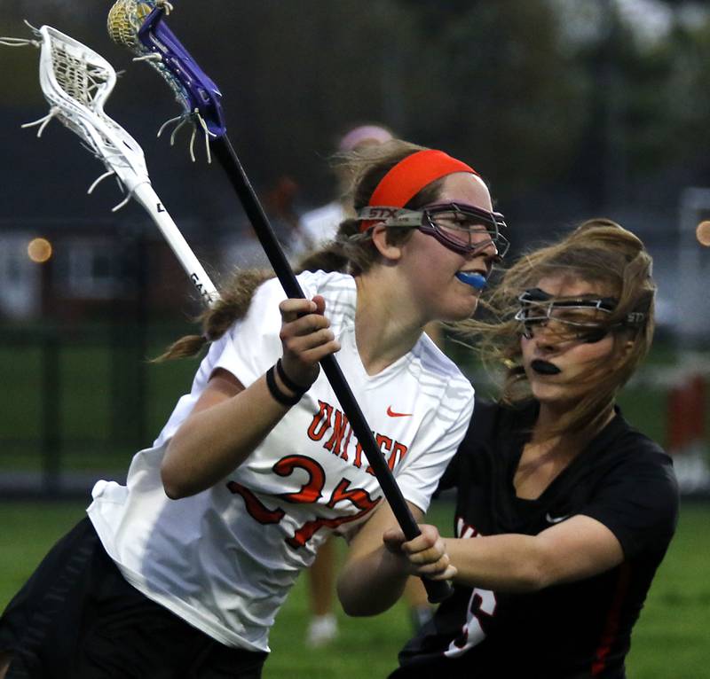 Crystal Lake Central co-op's Anna Starr is guarded by Huntley's Leah Holmberg during a Fox Valley Conference girls lacrosse match on Friday, April 17, 2026, at Crystal Lake Central High School.
