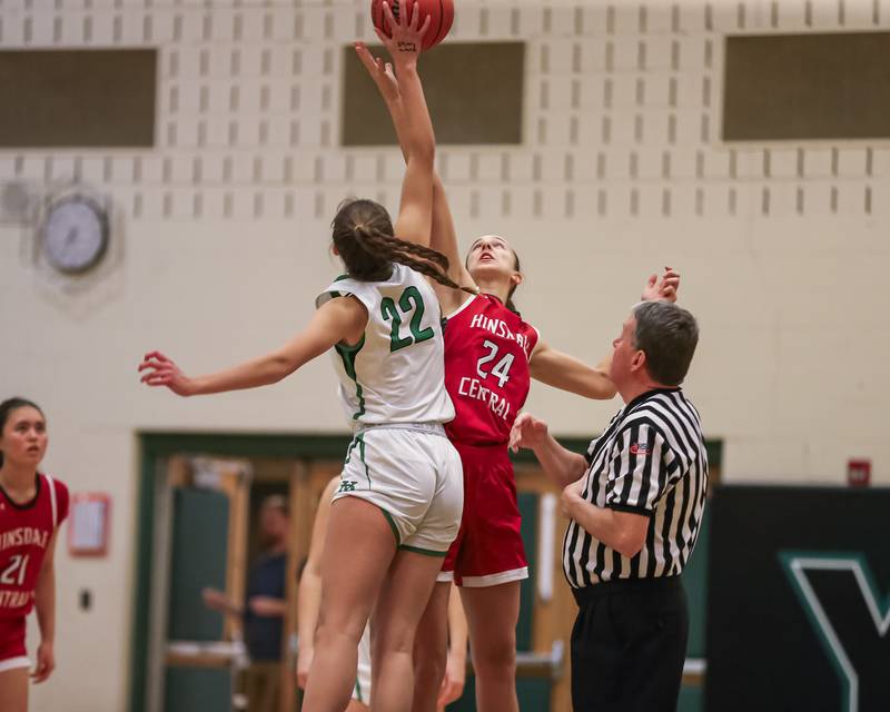 Hinsdale Central's Greta Dani (24) tips off with York's Stella Kohl (22) during basketball game between Hinsdale Central at York. Dec 8, 2023.