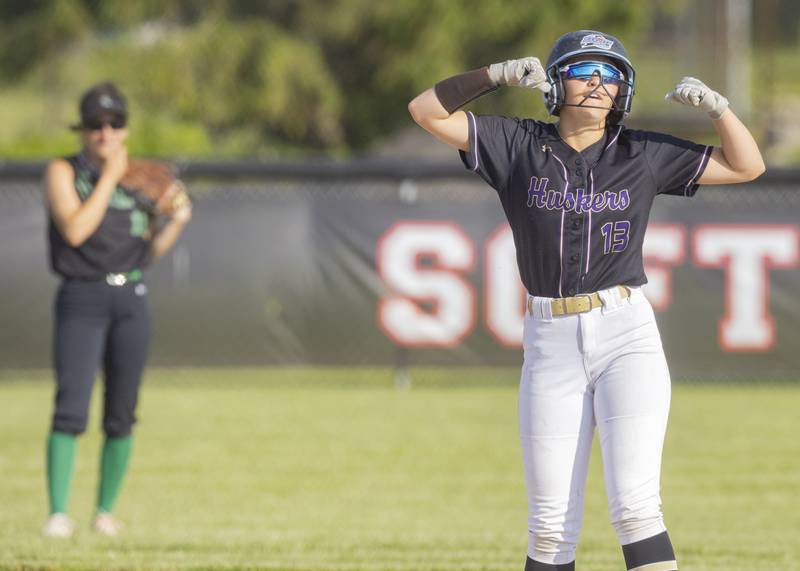 Brynley Glade of Serena High School flexes in celebration of her RBI scoring double against Dwight High School during the Class 1A Sectional semifinal game at Woodland High School on May 21, 2024.
