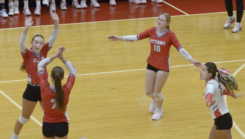 The Lady Pirates celebrate taking the lead against Sycamore in the 2nd set of Tuesday’s match at Ottawa.