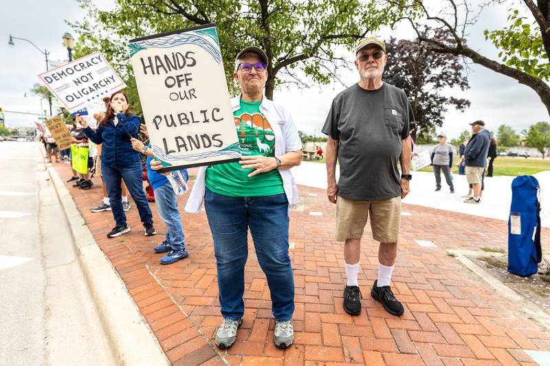 Joliet residents Rita and Bruce Renwick participate in the Good Trouble Lives On event in Downtown Joliet on July 17, 2025.