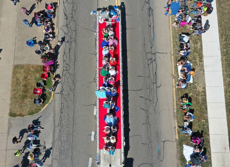 Bureau County pageant queens ride on a flatbed semi trailer during the 52nd annual Homestead Festival parade on Saturday, Sept. 9, 2023 in Princeton.