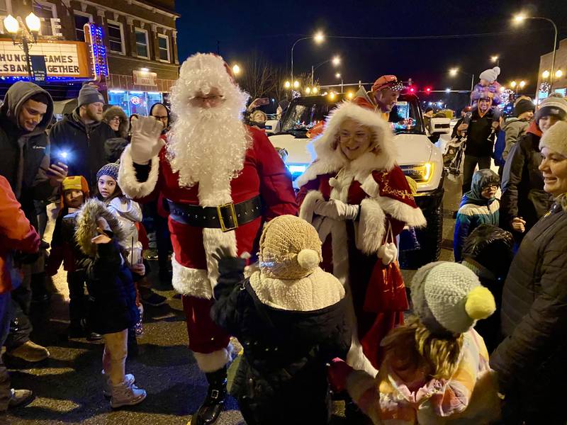 Santa Claus and Mrs. Claus were swarmed by eager children excited to get a hug, high five or chat in before marching down State Street in downtown Sycamore as part of Discover Sycamore's annual Walk with Santa on Friday, Dec. 1, 2023.