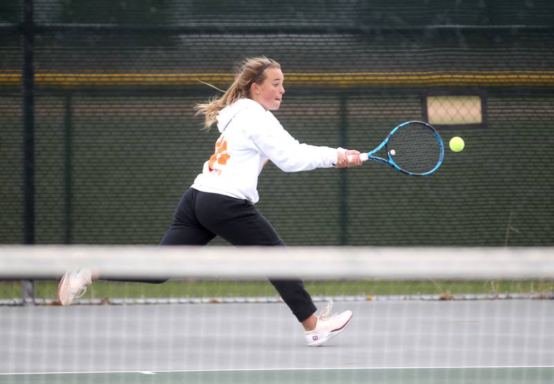 Wheaton Warrenville South’s Brooke Ittersagen goes after the ball during the first day of the IHSA state tennis tournament at Fremd High School on Thursday, Oct. 20, 2022.