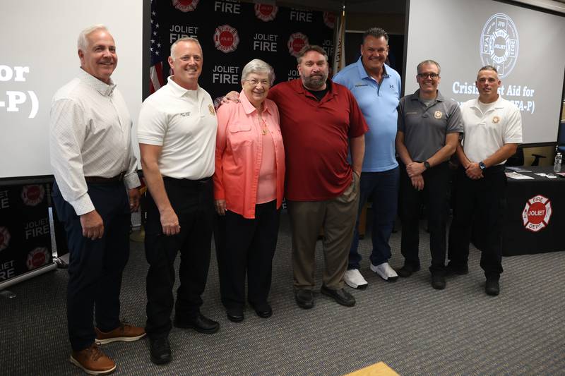 Mayor Terry D’Arcy, left, Fire Chief Jeff Carey, Sister Mary Frances Seeley, Mental Health Coordinator John Lukancic, Thriveworks Steve van der Watt, and Battalion Chiefs Aaron Kozlowski and John Koch pose for a photo at the Crisis First Aid refresher course for the Joliet Fire Department Station One crew on Wednesday, July 12th, 2023 in Joliet.