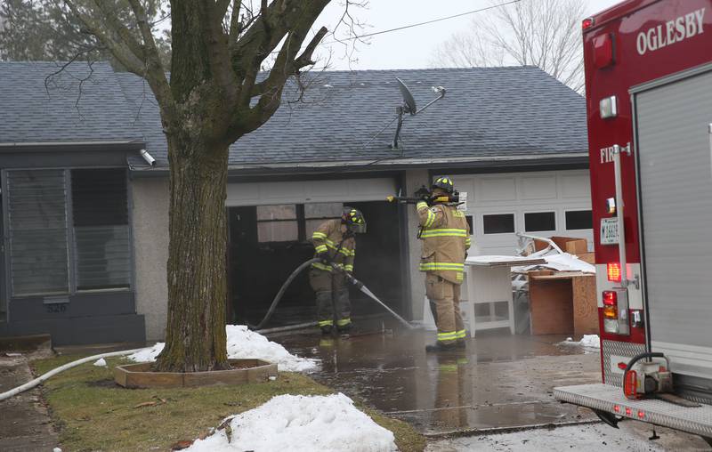 Oglesby firefighters wash down a driveway in the 500 block of Hayden Street on Monday, Jan. 29, 2024 in Oglesby. The fire happened shortly after 6:30a.m. Fire departments from Tonica, Utica, and Oglesby helped with the blaze. The home was unoccupied and is now considered uninhabitable.